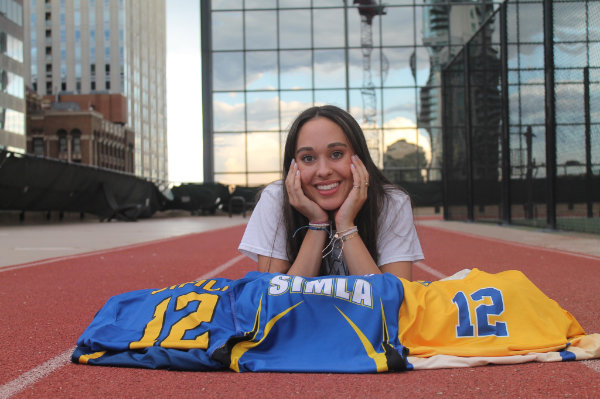 Zaida poses for camera with her simla sports uniforms display